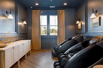 Recovery room with automated massage chairs